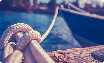 A close up of the end of a rope on a boat.