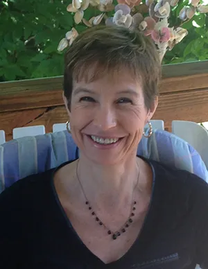 A woman sitting on top of a chair.